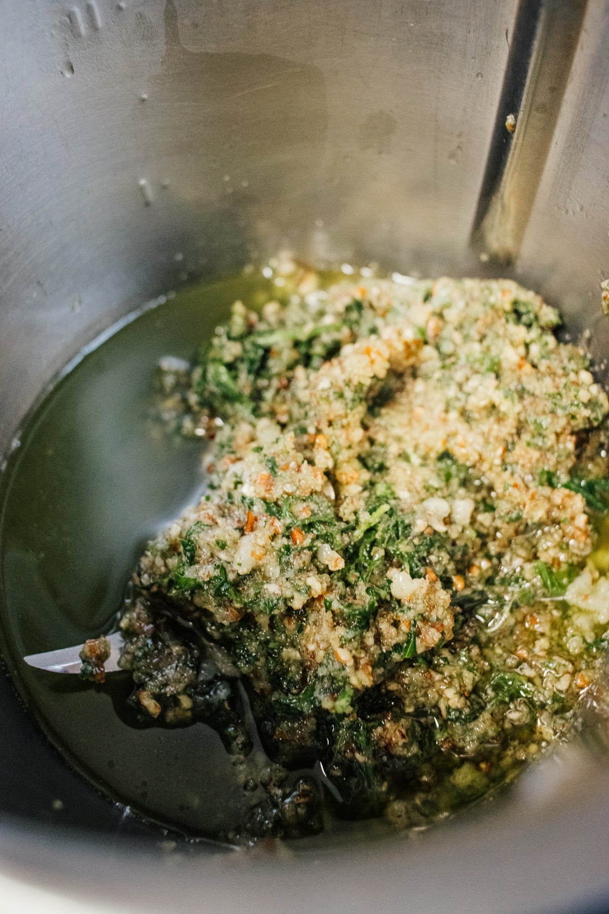 A metal bowl filled with a mixture of food
