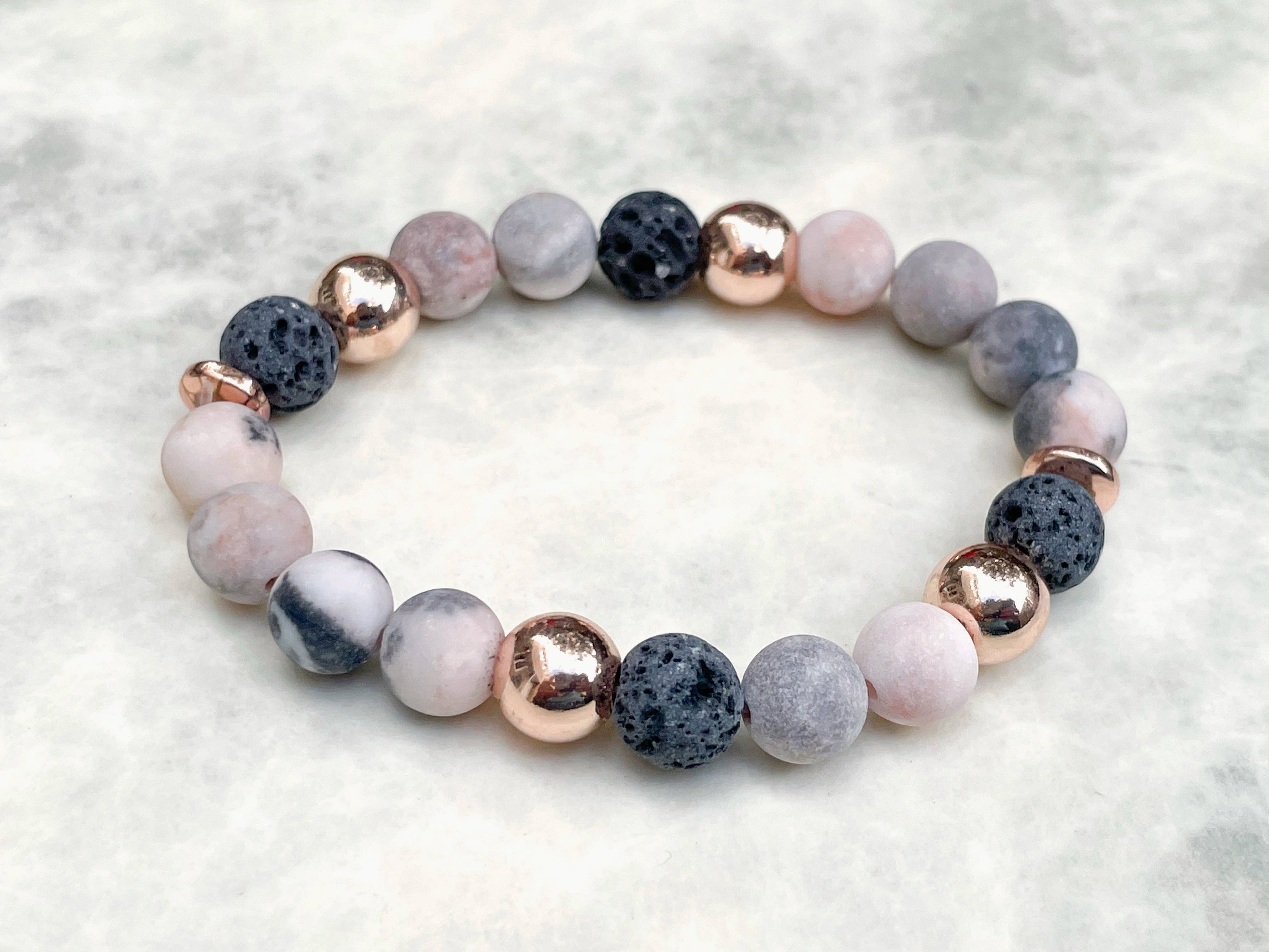 Bracelet en pierre de lave zebra rose
