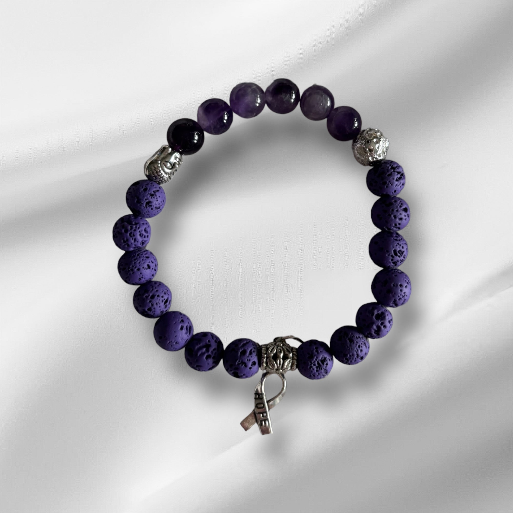 Pierres de lave mauves et argentees et amethystes et budda